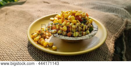 Steamed Yellow Sweet Corn Masala Or Corn Chat Prepared Using Butter, Chat Masala And Lemon, Favourit