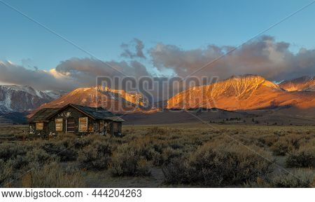 Abandoned Farm House In Front Of The Eastern Sierras At Sunrise