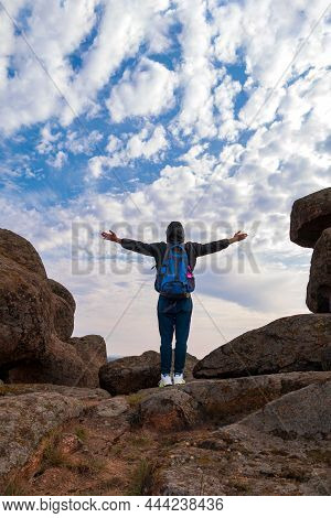 Traveler Hiker Man With Backpack Raised Hands Mountain Summit. Active Lifestyle Tourism Solo Travel