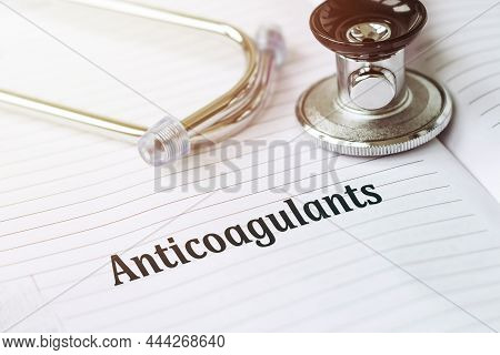 Anticoagulant. Text On A Medical Card Next To A Pen Stethoscope.