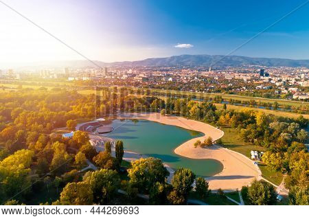 Bundek Lake And City Of Zagreb Aerial Autumn Sun Haze View, Green Zone Of Capital Of Croatia