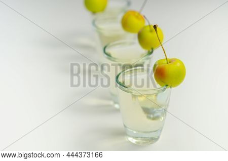 Delicious Calvados Served In Shot Glasses Decorated With Crab Apples