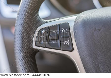 Black Steering Wheel With Multifunction Buttons For Quick Control. Cruise Control Buttons.close-up I