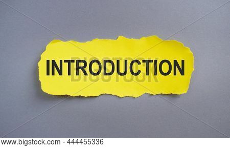 Introduction, Text On Yellow Torn Paper, Business Concept, Top View Flat Lay
