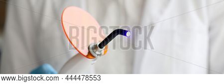 Dental Uv Polymerization Lamp And Artificial Jaw Model. Uv Lamp. Polymerization Uv Lamp Concept