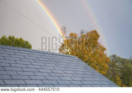 A Double Rainbow Rising Above A Rooftop In Torrington Connecticut On An Autumn Day.