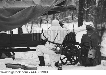 Hidden Re-enactor Dressed As German Wehrmacht Infantry Soldier In World War Ii Soldiers Sitting In A