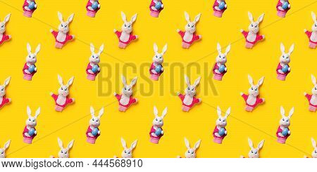Seamless Pattern With Easter Bunny And Egg Isolated On Yellow Background. Funny Texture. Education T