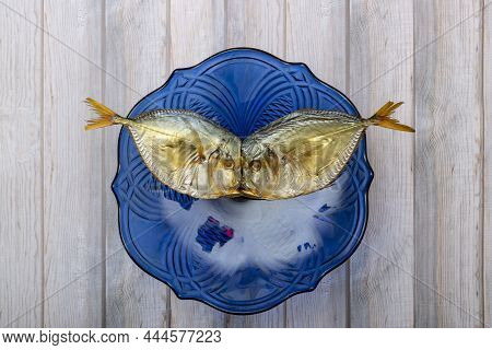 Two Smoked Sea Fish Close-up In A Plate