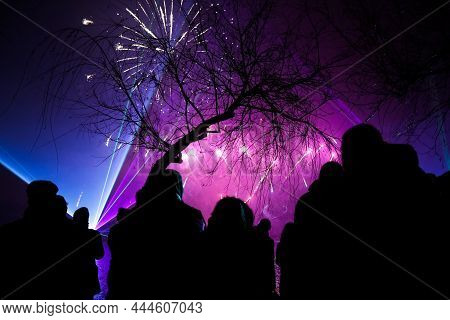 Bucharest, Romania - January 1, 2022: People Watch Fireworks During New Years Celebrations In The Al