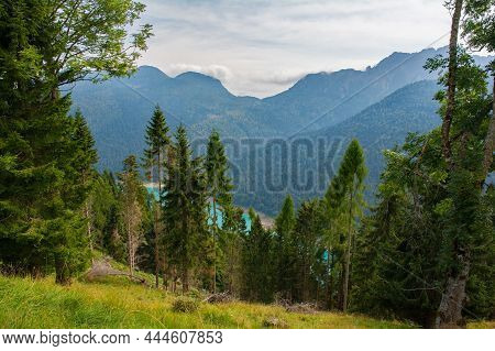Sauris Dam Seen Through The Trees On The Slopes Monte Ruke Near Sauris Di Sopra, Udine Province, Fri