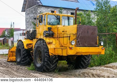 Novyy Urengoy, Russia - July 29, 2021: Bright Soviet Agricultural Tractor Kirovets K-701 At A Countr