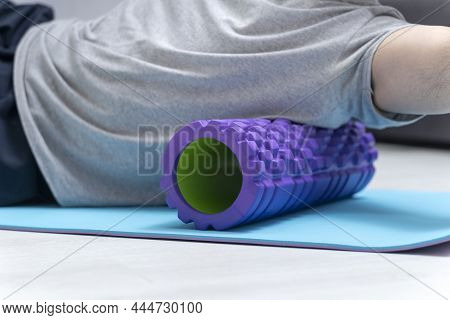 Man Doing Fascia Exercise. Foam Roller Back Pain Treatment And Myofascial Release. Tools For Self-ma