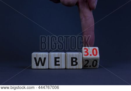 Web 2.0 Or 3.0 Symbol. Businessman Turns A Wooden Cube And Changes Words Web 2.0 To Web 3.0. Beautif