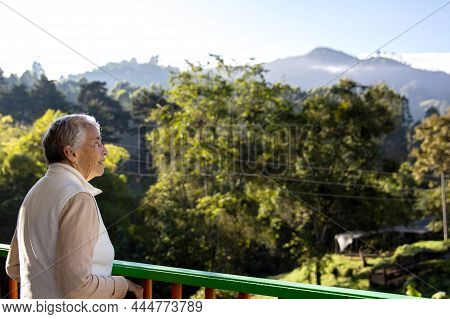 Senior Woman At A Traditional Colorful Balcony In The Beautiful Colonial Town Of Salento In The Regi