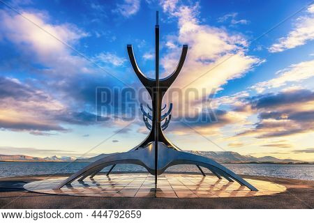 Reykjavik, Iceland. - 6 October 2021: The Sun Voyager, a modern sculpture by Jon Gunnar Arnason, of a viking ship. Sunrise in Reykjavik, Iceland.