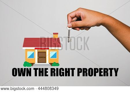 A Picture Of Men Holding Key With The House Illustration And Own The Right Property Word. Learn To G