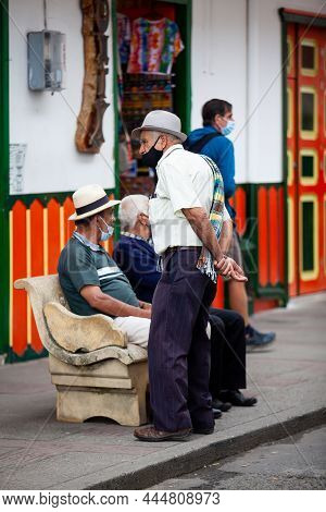 Salento, Colombia - July 2021. Senior Local Man Wearing Traditional Poncho And Hat At The Beautiful