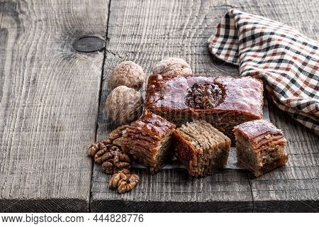 Traditional  Arabic Dessert Baklava On Wooden Table