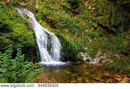 Highest  cascading waterfall - Allerheiligen. Famous forest in the center of Europe - Schwarzwald. Travel to the fabulous country of the Black Forest. Autumn cloudy day. Germany. 