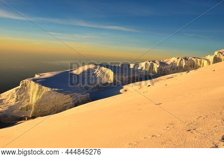 Sunrise On The Uhuru Peak Kilimanjaro In Tanzania. Glacier On The Highest Mountain In Africa. Rebman