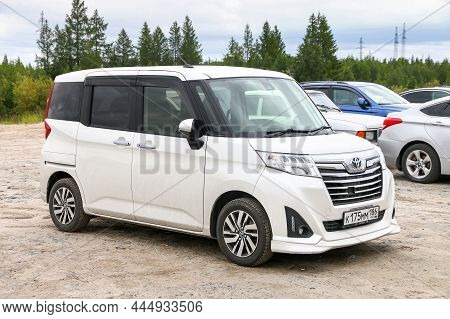 Novyy Urengoy, Russia - August 14, 2021: White Japanese Mini Mpv Car Toyota Roomy In A City Street.