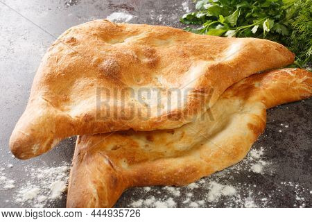 Georgian Traditional Bread Shotis Puri Close-up On The Table. Horizontal
