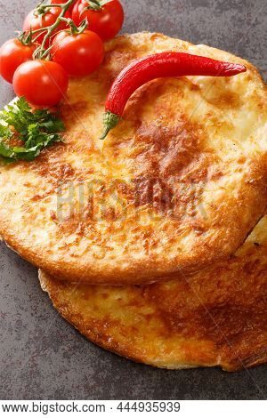 Georgian Khachapuri Mingrelian With Sulguni Cheese Close Up In The Table. Vertical Top View From Abo