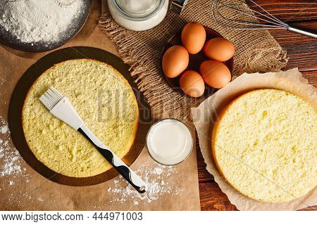 Flat Lay Impregnation With A Milk Of Biscuit With A Silicone Brush. Baking A Sponge Biscuit Cake. Co