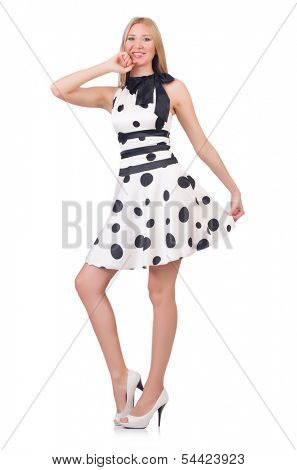 Tall model dressed in dress with polka dosts on white