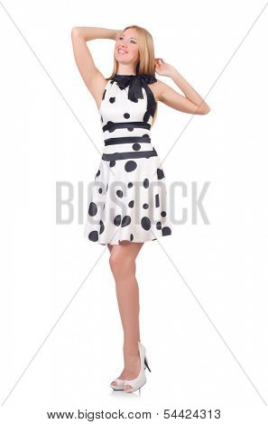 Tall model dressed in dress with polka dosts on white