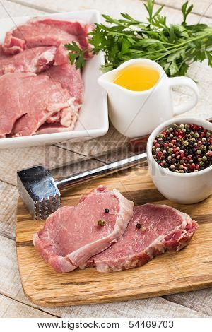 Fresh Raw Meat On Wooden Background With Pepper