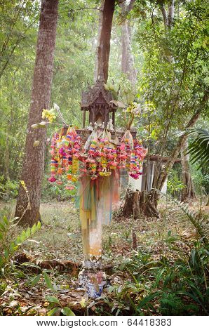 Spirit House In Thailand With Flowers In Vases And Some Wreathes,  House Joss