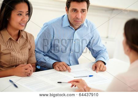 Male And Female Couple Interested In A Contract