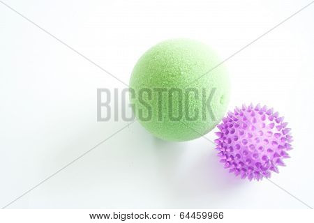 Purple and Green Stress Balls Isolated