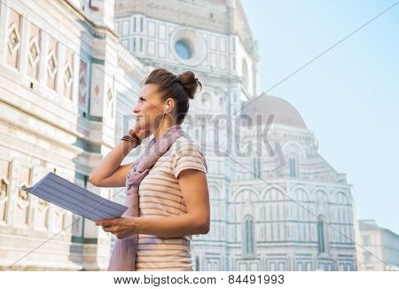 Young Woman With Map And Audio Guide In Front Of Cattedrale Di Santa Maria Del Fiore In Florence, It