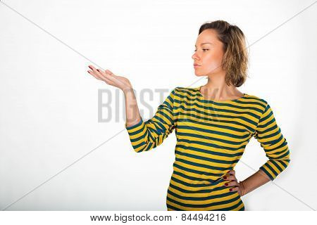 Beautiful young athletic blonde girl posing on a light background in yellow sweater-Chorna