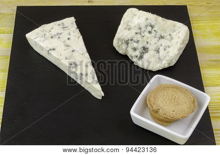 Roquefort And Gornozola Over Slate Plate.