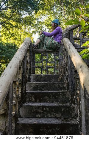 Beautiful young woman in old tample