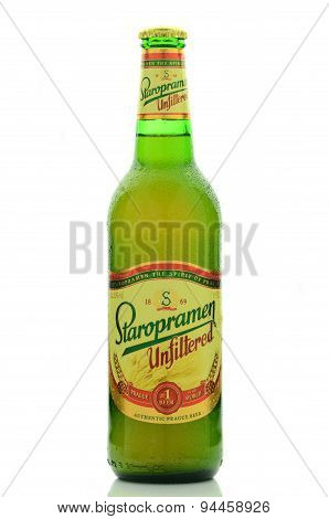 Staropramen unfiltered premium beer isolated on white background