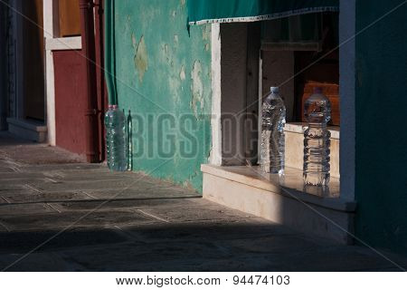View Of Burano Island Street With Tree Botle Of Water