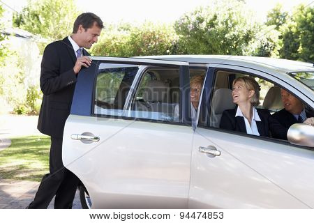 Group Of Business Colleagues Car Pooling Journey Into Work