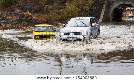 Odessa, Ukraine - September 20, 2016: Driving Cars On A Flooded Road During Flooding Caused By Torre