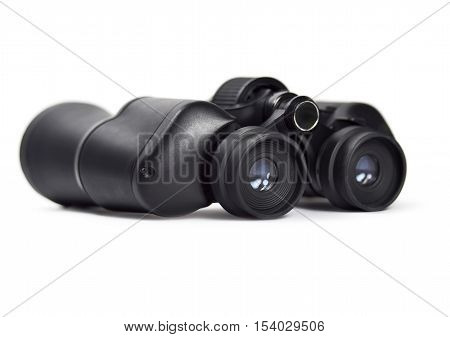 Black binoculars, isolated on white background with copy space. Spy glass.