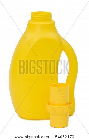 Yellow plastic bottle with a dispenser in cap isolated on white background. Detergent for ware and cleaning in kitchen.