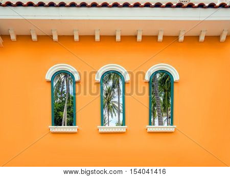Round arch window on the orange wall