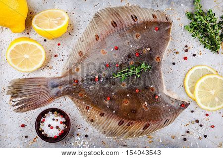 Raw Flounder Fish, Flatfish On Rustic Background