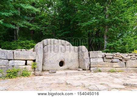 Dolmen single-chamber megalithic tomb of the Middle Bronze Age (3000-2000 BC). Valley of Zhane River near the village Vozrozhdenie in the vicinity of the resort city of Gelendzhik. Western Caucasus Krasnodar region of Russia.