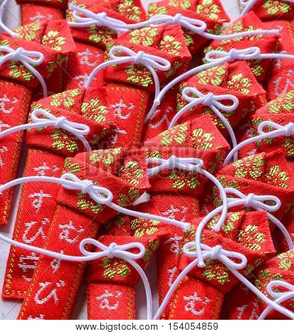 Pile of red and white ribbon japanese amulet