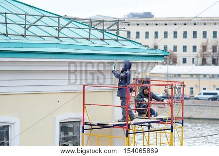 Moscow, Russia - October, 16, 2016: workers restore a house in thecenter of Moscow, Russia

